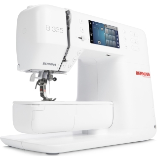 The B 335 has the option to use an knee lifter, and includes the sliding buttonhole foot #3A