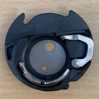 Janome bobbin case with rocker arm