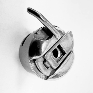 Bobbin case left hand finger type