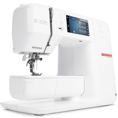 The B 335 has the option to use an knee lifter, and includes the sliding buttonhole foot #3A